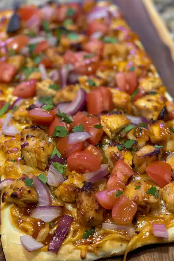 BBQ Chicken Flatbread taken with iphone 15 pro max --iw 2 --ar 4:5 --v 6.0 --raw