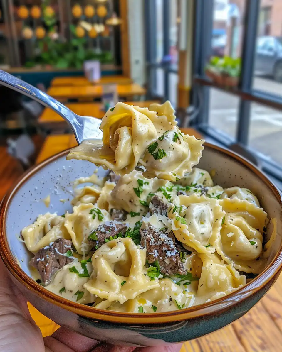 Steam rising from pressure cooker with cheesesteak tortellini
