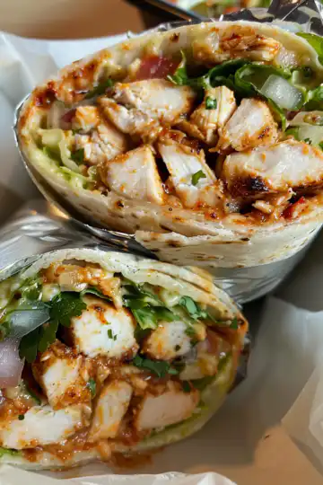 Chipotle Ranch Grilled Chicken Burrito taken with iphone 15 pro max --iw 2 --ar 4:5 --v 6.0 --raw