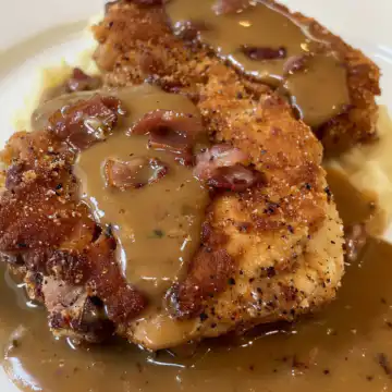 Country Fried Pork Chops with Bacon Gravy taken with iphone 15 pro max --iw 2 --ar 4:5 --v 6.0 --raw