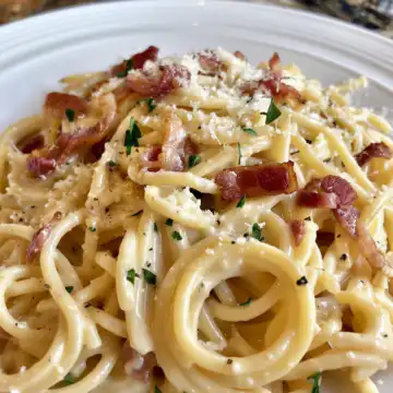 Creamy Bacon Carbonara Pasta taken with iphone 15 pro max --iw 2 --ar 4:5 --v 6.0 --raw