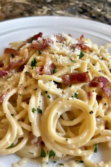 Creamy Bacon Carbonara Pasta taken with iphone 15 pro max --iw 2 --ar 4:5 --v 6.0 --raw