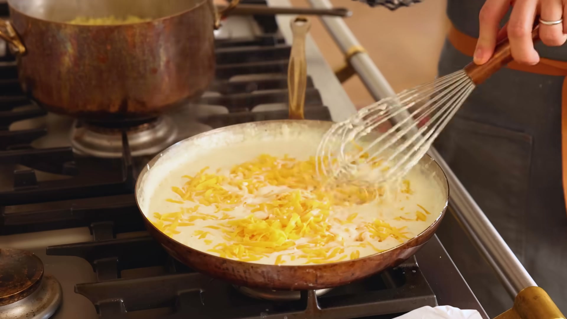 Close-up of creamy baked mac and cheese showing the texture and color detail