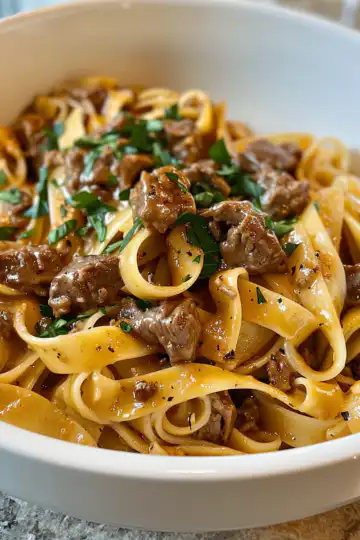 Creamy Beef Pasta taken with iphone 15 pro max --iw 2 --ar 4:5 --v 6.0 --raw