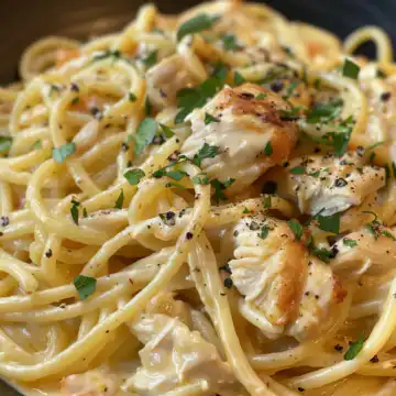 Creamy Cajun Chicken Spaghetti with Garlic taken with iphone 15 pro max --iw 2 --ar 4:5 --v 6.0 --raw
