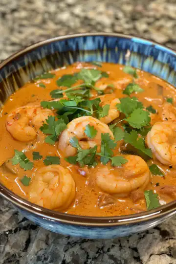 Creamy Seafood and Shrimp Chili taken with iphone 15 pro max --iw 2 --ar 4:5 --v 6.0 --raw