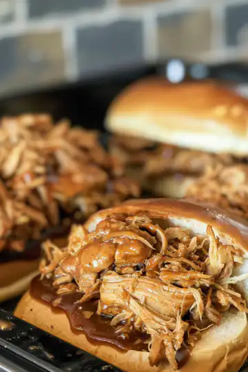 Crockpot BBQ Pulled Chicken taken with iphone 15 pro max --iw 2 --ar 4:5 --v 6.0 --raw