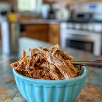 Crockpot BBQ Pulled Chicken taken with iphone 15 pro max --iw 2 --ar 4:5 --v 6.0 --raw