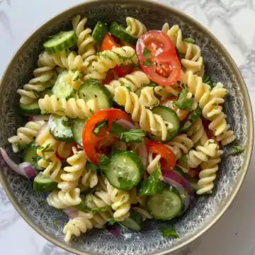 Cucumber Pasta Salad taken with iphone 15 pro max --iw 2 --ar 4:5 --v 6.0 --raw
