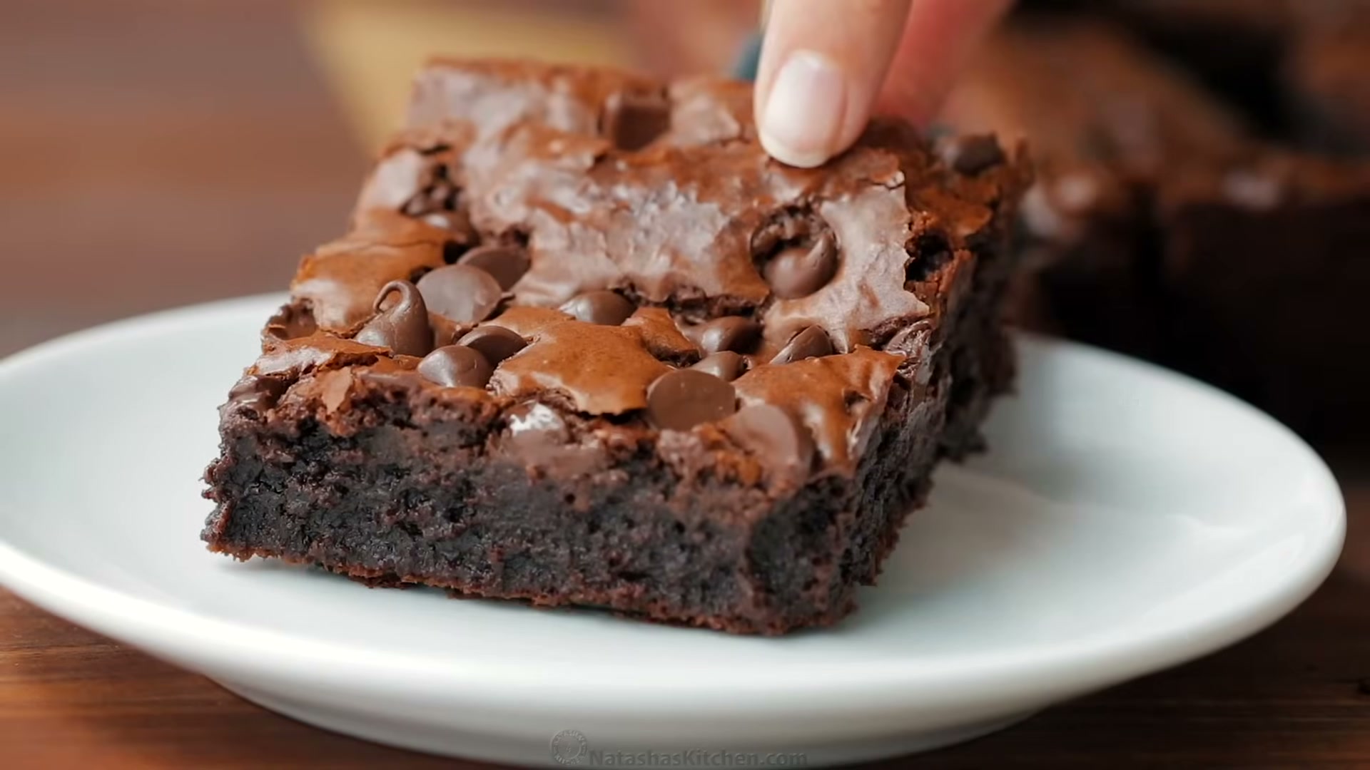 Side view of easy fudgy brownies ready to serve