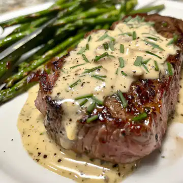 Garlic Butter Steak with Parmesan Cream Sauce taken with iphone 15 pro max --iw 2 --ar 4:5 --v 6.0 --raw