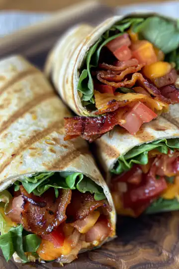 Grilled BLT Wraps taken with iphone 15 pro max --iw 2 --ar 4:5 --v 6.0 --raw