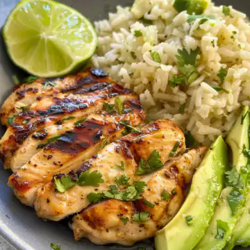 Honey Lime Chicken and Avocado Rice taken with iphone 15 pro max --iw 2 --ar 4:5 --v 6.0 --raw