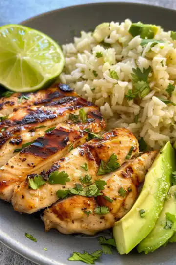 Honey Lime Chicken and Avocado Rice taken with iphone 15 pro max --iw 2 --ar 4:5 --v 6.0 --raw