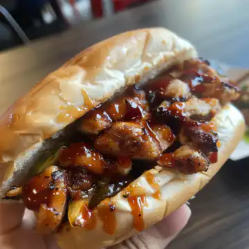 Korean BBQ Chicken Sandwich taken with iphone 15 pro max --iw 2 --ar 4:5 --v 6.0 --raw