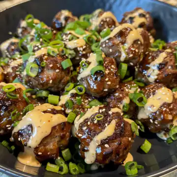 Korean BBQ Meatballs with Spicy Mayo Dip taken with iphone 15 pro max --iw 2 --ar 4:5 --v 6.0 --raw
