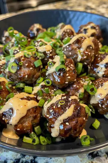 Korean BBQ Meatballs with Spicy Mayo Dip taken with iphone 15 pro max --iw 2 --ar 4:5 --v 6.0 --raw