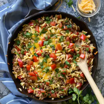 One Pot Cheeseburger Orzo Skillet taken with iphone 15 pro max --iw 2 --ar 4:5 --v 6.0 --raw