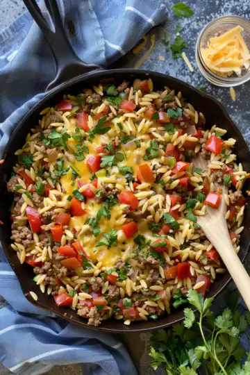 One Pot Cheeseburger Orzo Skillet taken with iphone 15 pro max --iw 2 --ar 4:5 --v 6.0 --raw
