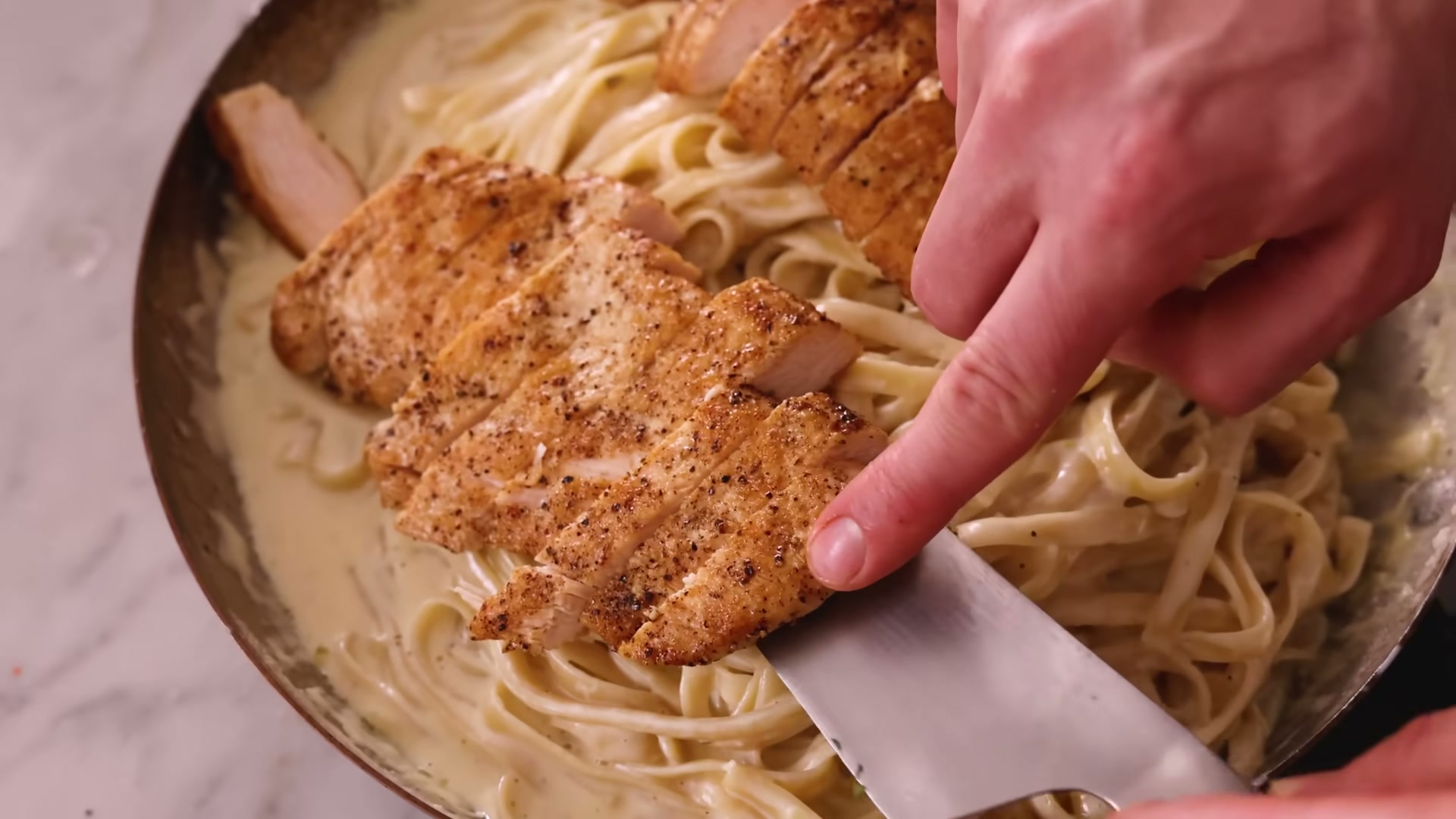 Side view of one-pot chicken alfredo pasta ready to serve