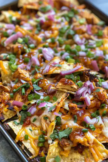 Sheet Pan BBQ Chicken Nachos taken with iphone 15 pro max --iw 2 --ar 4:5 --v 6.0 --raw